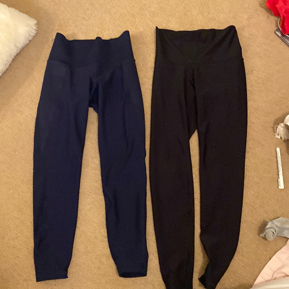 Small, Old Navy leggings, one black and one navy. Black ones have small defect